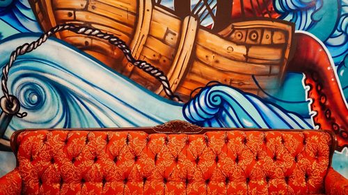 Couch in front of boat mural (Unsplash) — Mexico City
